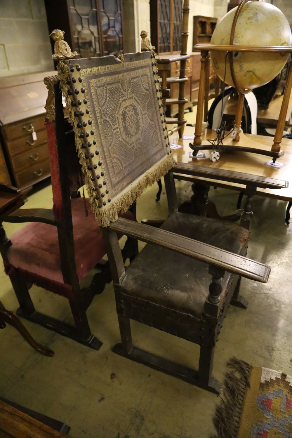 Two carved walnut Italian Renaissance style open armchairs,